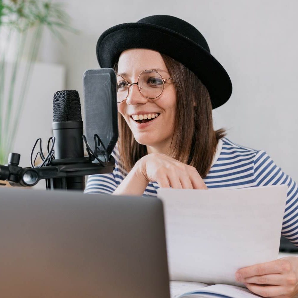 Voice artist recording commercial advertisement audio in studio setup